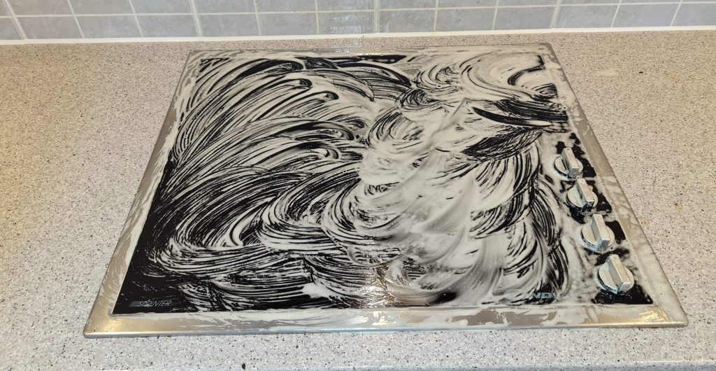 scrubbing a hob