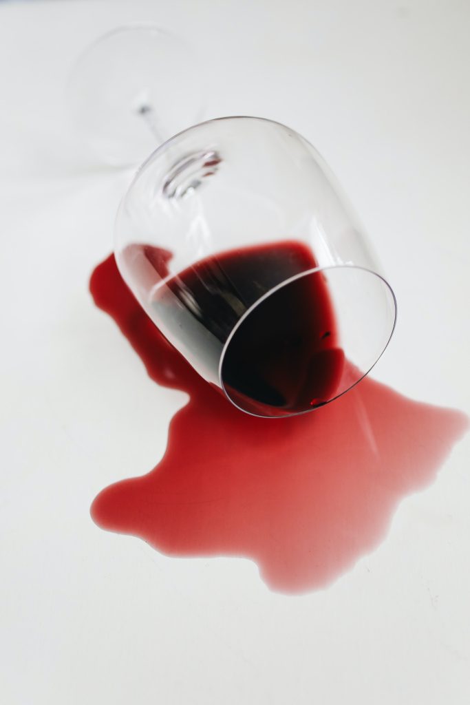 spilling red wine