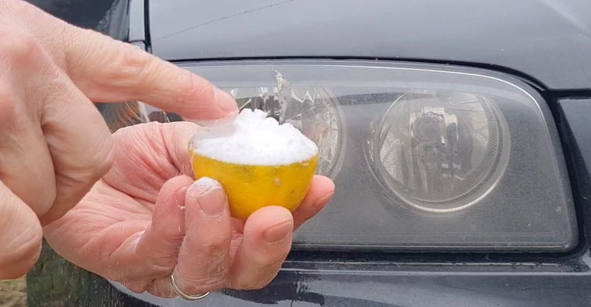 patting down bicarbonate of soda onto lemon